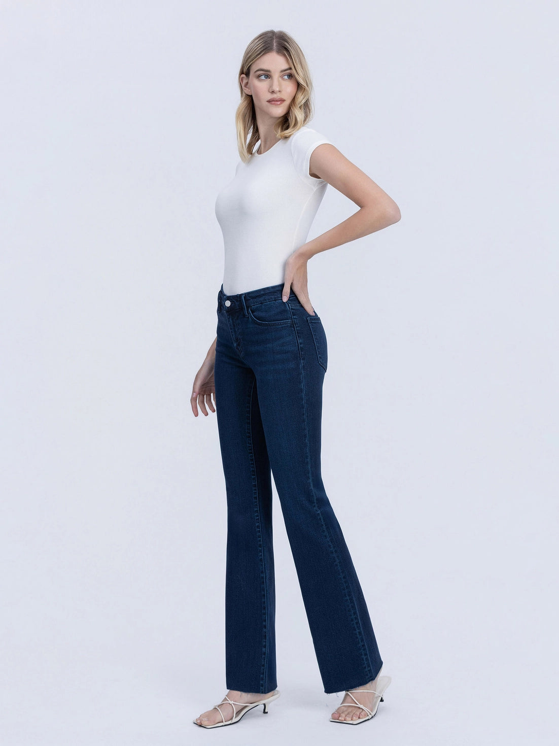 PERIWINKLE MID RISE RAW HEM BOOTCUT JEANS
